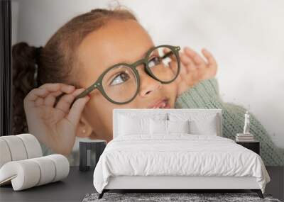 Child, glasses and eye care for vision, focus and concentration while wearing quality lens frame optician choice. Face of girl looking happy about optics fashion mockup for eyesight correction Wall mural