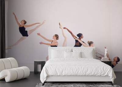 Group of contemporary or ballet dancers performing a unique sequence in a studio. Team of modern elegant ballerinas dancing or practicing for performance and creating entertainment art Wall mural