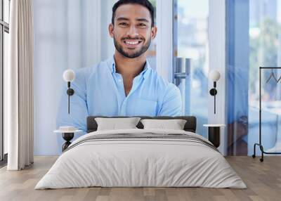 Its been a productive business day. Shot of a young businessman in his office. Wall mural