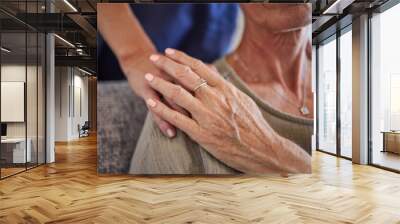 Senior, hands and care for love, support in mature health and generations indoors at home. Hand of a elderly lady holding caregiver in trust, comfort and reliable gentle embrace and respect for elder Wall mural