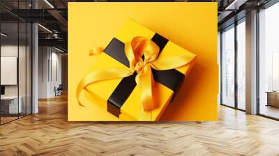 Bright yellow gift present box with ribbon. Generative ai. Wall mural