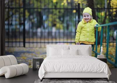 Children walk in the autumn park Wall mural