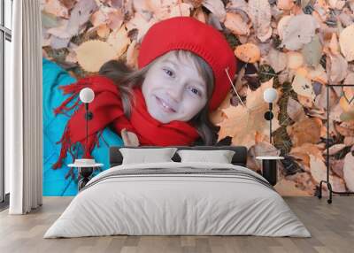 Girl in autumn city park in leaf fall. Young beautiful mother wi Wall mural