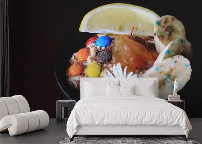 ice cream with grated chocolate bananas and dragees Wall mural