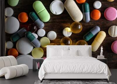 Medications on a textured wooden background Wall mural