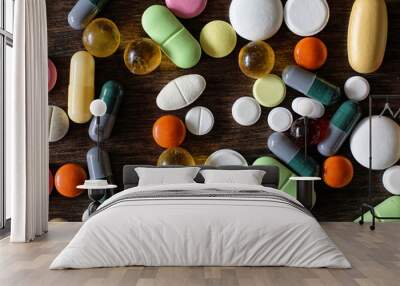 Medications on a textured wooden background Wall mural