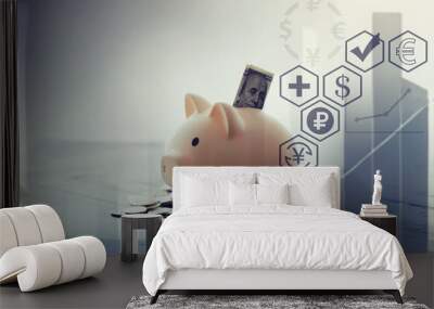 Piggy bank with coins on wooden background. Wall mural