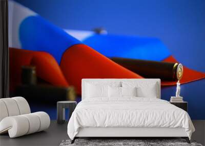 Russian flag and bullet casings on the table. Background concept Russian army. Wall mural