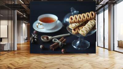 Set for breakfast. Sweets and pastries with nuts for tea on a bl Wall mural