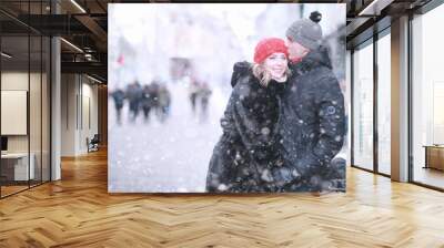 Young couple walking through the winter Wall mural