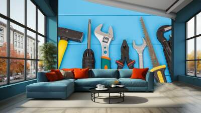 Work tools on blue wooden background Wall mural