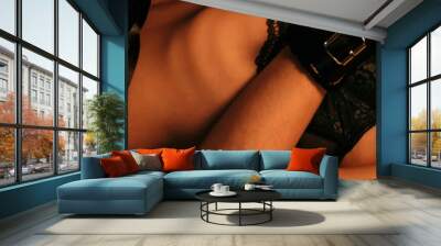 body of a slender sexy young girl with a whip and handcuffs on the bed in underwear. Panoramic wide horizontal photo for banner head cover Wall mural