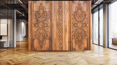 traditional oriental Uzbek Islamic patterns arabesque ornament on an old wooden carved door in Uzbekistan close-up Wall mural