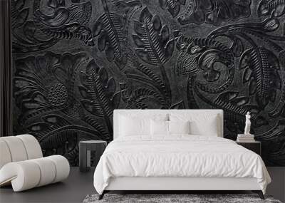 Embossed shiny black leather with the floral motif Wall mural