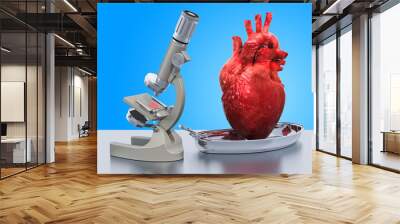 Research and diagnostics of heart disease concept. Laboratory microscope with human heart, 3D rendering Wall mural