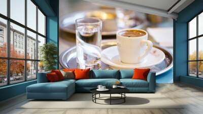 Cup of coffee and glass of water Wall mural