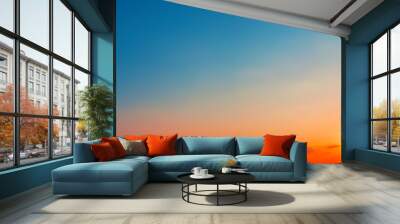 Panorama of dramatic sunset sky with setting sun Wall mural