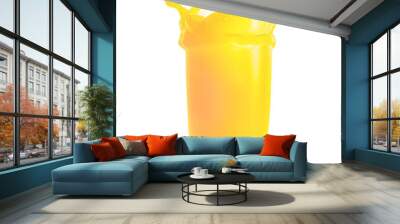 Splash of fresh orange juice in transparent glass isolated on white background Wall mural