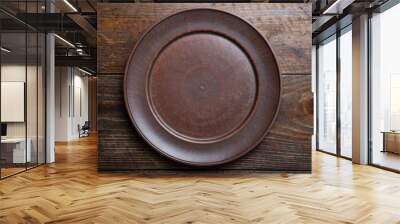 empty clay plate on wooden background Wall mural