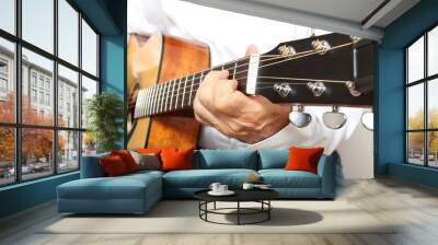 Hands of a musician playing classical acoustic guitar Wall mural