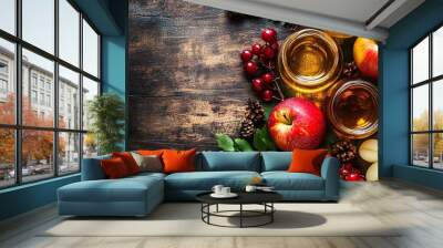 Autumn-themed rustic wooden table with apple cider, red apples, and berries Wall mural