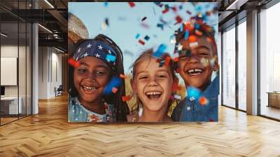 Four happy kids laughing and tossing confetti in the air, joyously celebrating a special event Wall mural