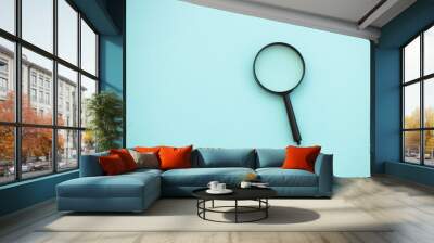 magnifying glass on blue background. Search concept Wall mural