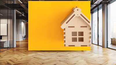 Mini wooden house on yellow background, Residence and House Loan Concept. Wall mural