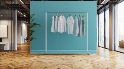 Minimalist clothes rail displaying white and blue clothing with potted plant Wall mural