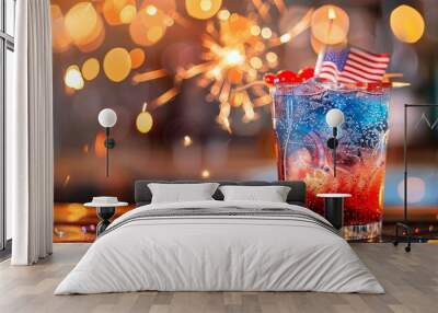 Red, white, and blue layered cocktail is sparkling on a bar top for independence day Wall mural