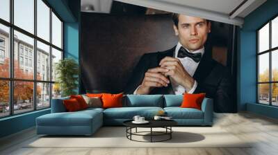 Sexy fashionable man celebrity in tuxedo indoor Wall mural