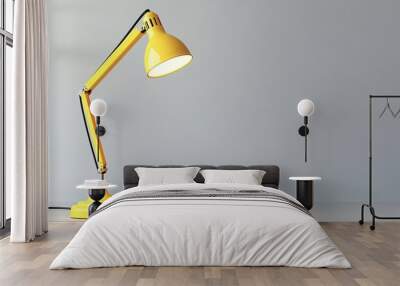 Yellow desk lamp illuminating a grey wall in the room Wall mural