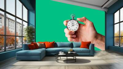 timer hold in hand, button pressed Wall mural