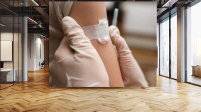 Adhesive bandage on arm after injection vaccine. Wall mural