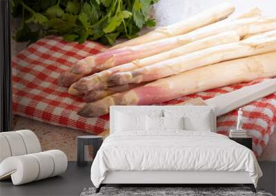 raw white asparagus on a table with a knife Wall mural