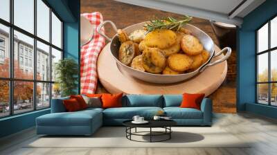 sarladaise potatoes in a dish with rosemary Wall mural