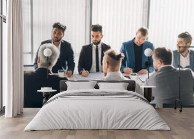 Business Discussion Meeting Presentation Briefing with the participation of male stuff only. Formally dressed multiracial men, working as a team, working out new strategy of development Wall mural