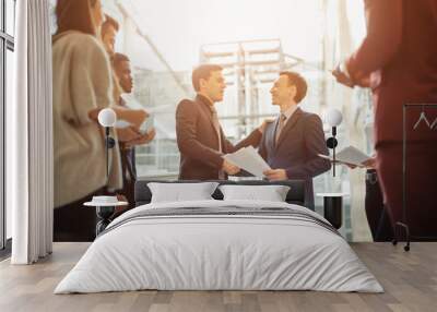 Business people shaking hands in the office after the contract is signed Wall mural