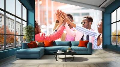 Business Team shows its friendship. friendly young african people joining their hands Wall mural