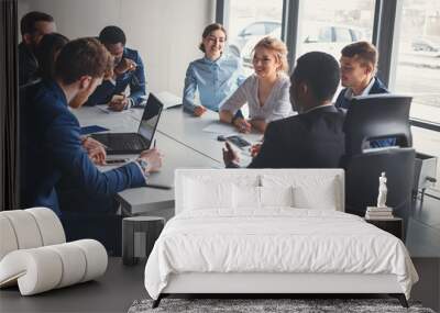 Businesspeople discussing together in conference room during meeting at office Wall mural