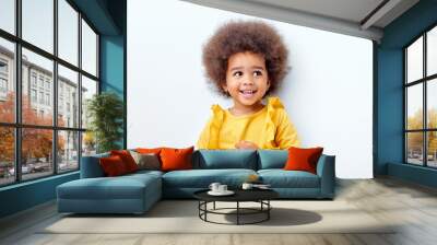 cheerful fluffy african american girl looking happy holding magic wand in hands, laughing, isolated on white studio background. portrait. people diversity, african ethnicity, childhood concept Wall mural