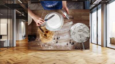 Chef decorating a delicious cake with cream Wall mural