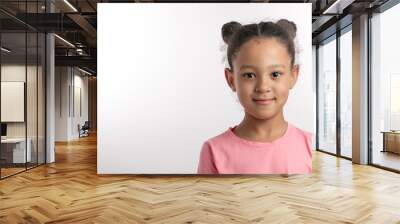 closeup portrait of an adorable girl wearing two buns isolated on the white background. copy space. children and people cocncept Wall mural