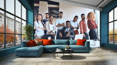 happy successful african business leader and team in the office. partnership Wall mural