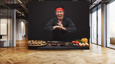 kung fu training while cooking. crazy mad man with funny grimace. close up photo.karate position. martial art concept. welcome Wall mural