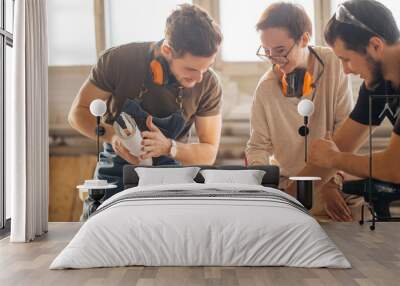 male Carpenter Training Female Apprentice To Use Plane Wall mural