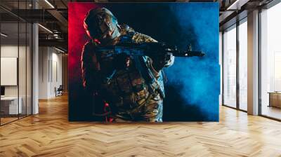 militant soldier man in action, wearing green uniform with special equipment, shooting, pointing gun side isolated over smoky UV background Wall mural