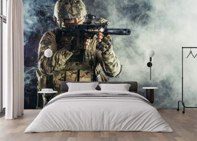 military, army, soldiers concept. brave young soldier prepare to attack holding gun in white foggy space Wall mural