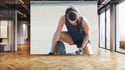 Strong woman exercising with barbell.girl preparing for weightlifting workout Wall mural