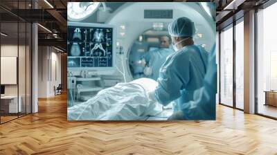 An interventional radiology surgeon performs a catheter-based treatment using X-ray visualization. Wall mural